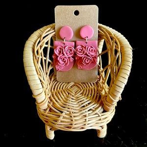 Polymer clay earrings. Mauve-like color with florals and leaf accents.